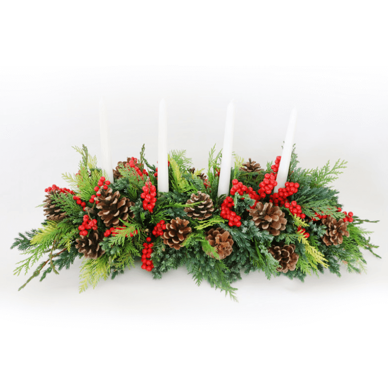 Arrangement with four tall candles long and low flower design for Christmas with candles
