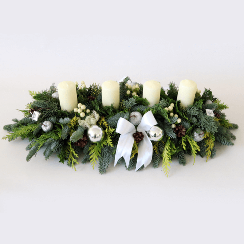 Festive Table Arrangement long and low white and green christmas arrangement