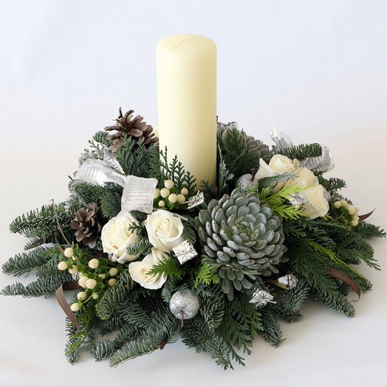 Medium Festive Table Arrangement White candle and white roses with succulents and nordic spruce