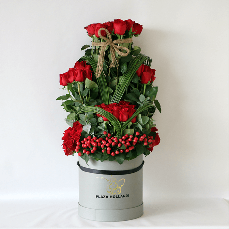 red rose design in a hat box red roses, hypericum and greenery in a plaza hollandi hat box