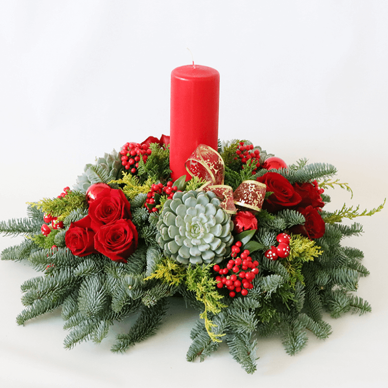 Red Festive table arrangement red pillar candle with succulents and red rose