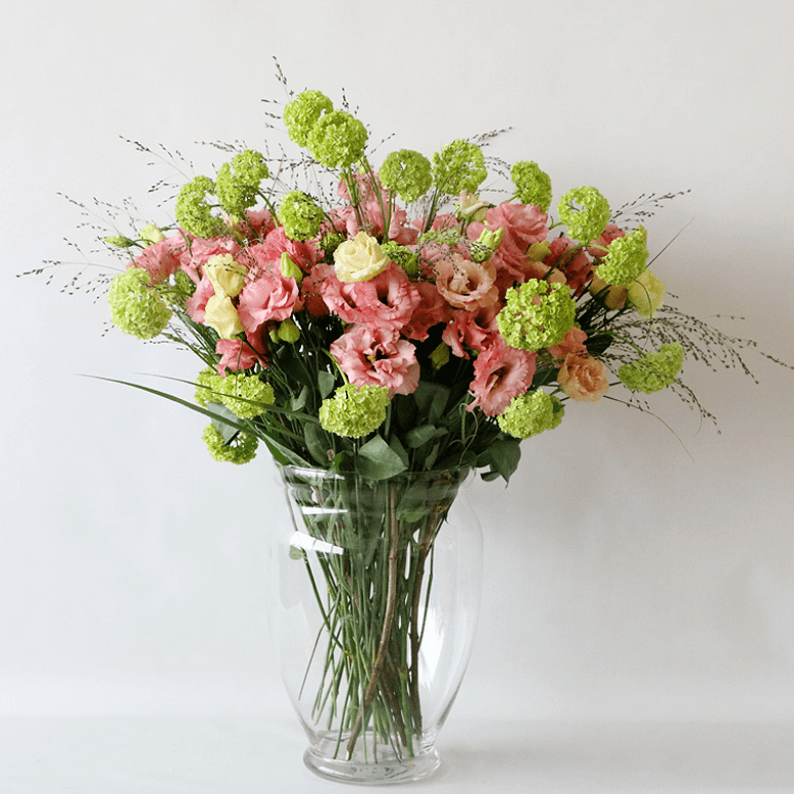 Weekly Flower Subscription 1 vase_1 Pink eustoma in a glass vase with snowball and grass