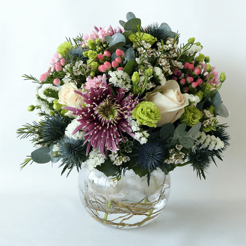 Weekly Flower Subscription 3 vases_1 Round purple, green and white arrangement in a glass vase