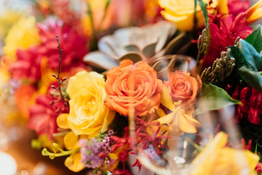 The Meaning of Roses 23 Mixed red, orange and yellow flowers