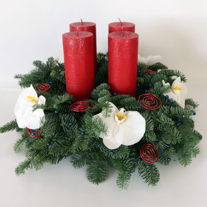Arrangement with four red candles and orchids Arrangement with four red candles and orchids