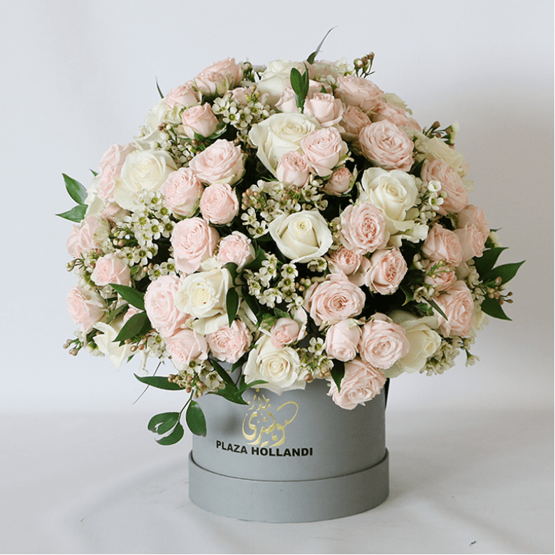 peach and pink round hat box design peach and pink spray roses in a round design in a hat box