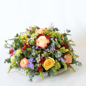 orange, yellow and red flower design on a plate