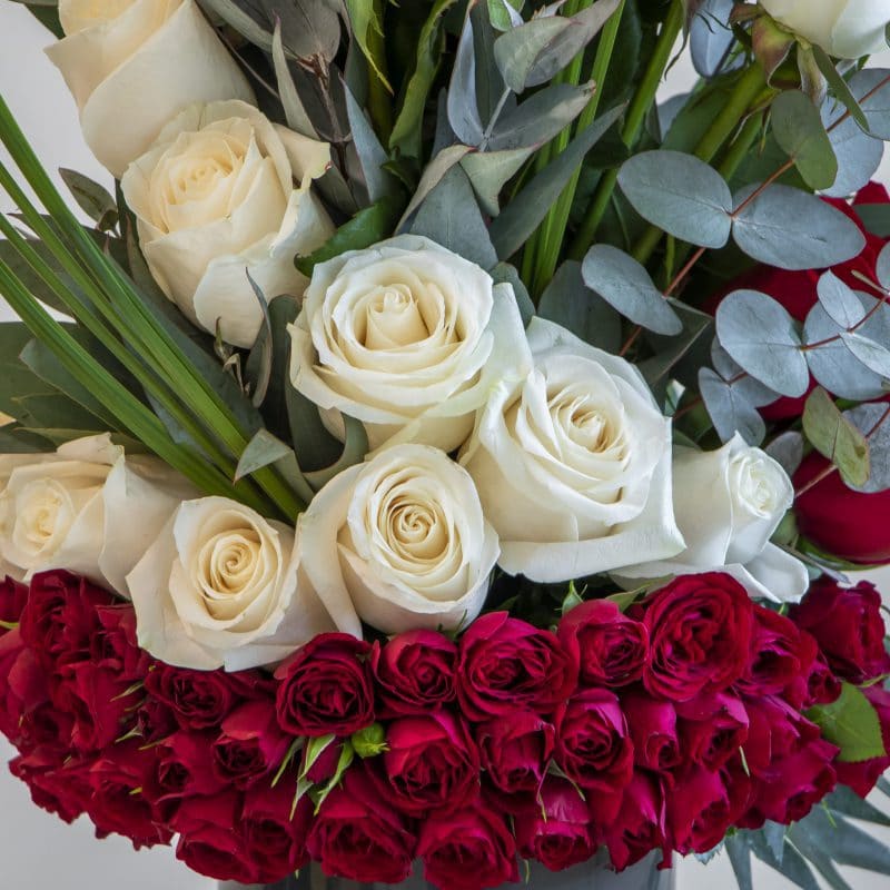 ROSE ARRANGEMENT 2 CLOSE close up of white and red roses in a flower arrangement