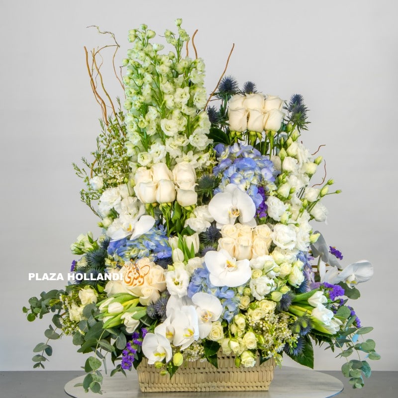 IMG_4628 logo Blue, white and cream flower arrangement
