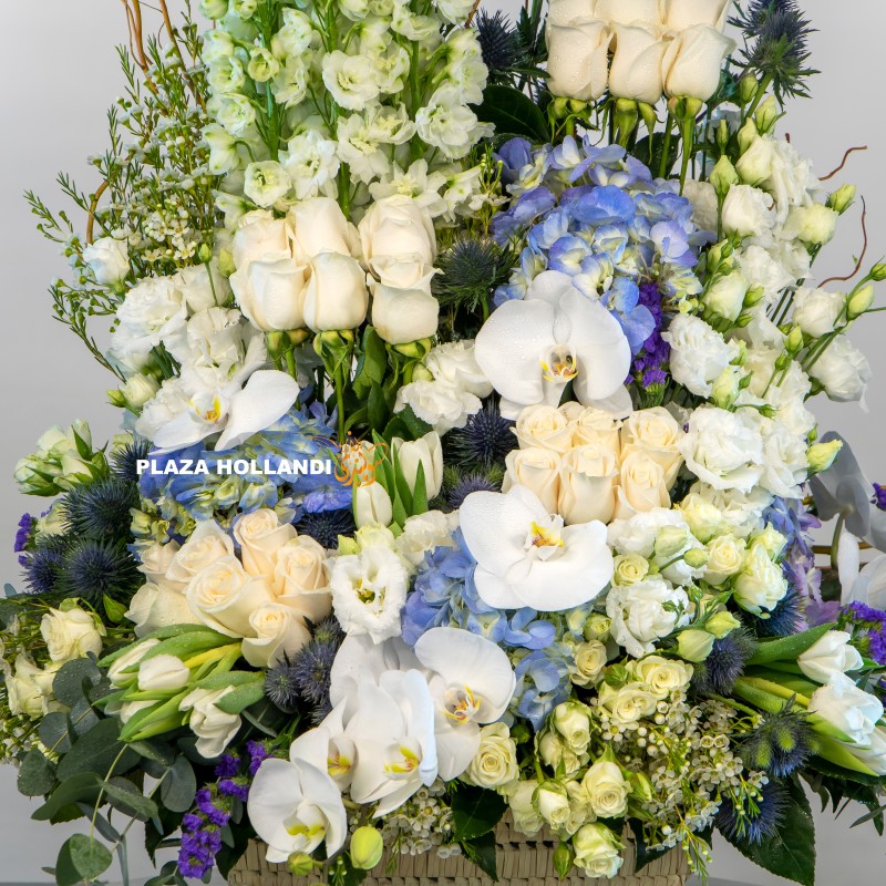 IMG_4630 logo blue, white and green flower arrangement