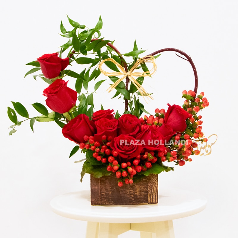 Heart design valentine red roses in a brown box hypericum