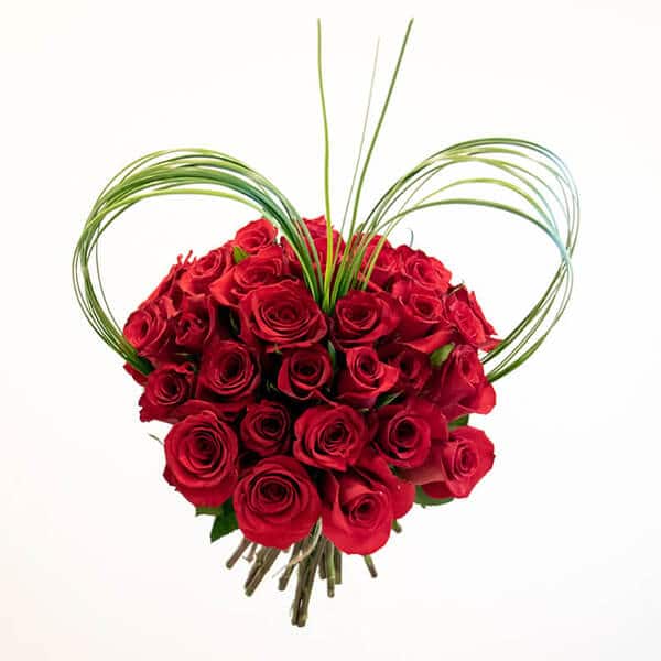 Red Heart Red roses bouquet with steel grass