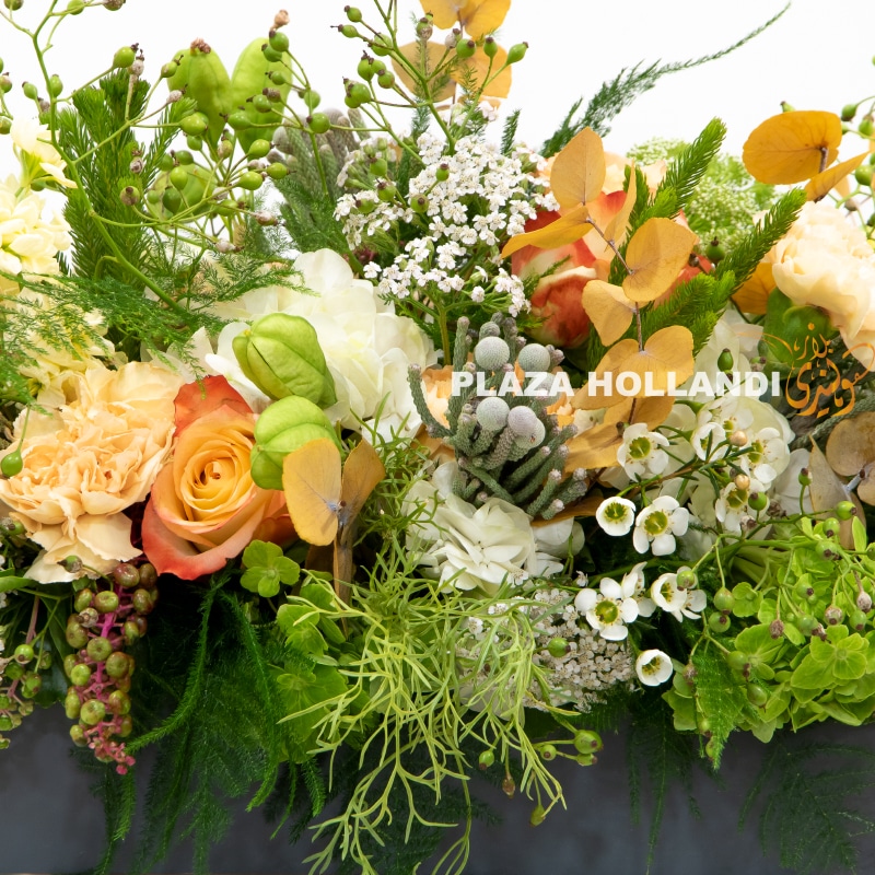 2 orange, cream and white flowers