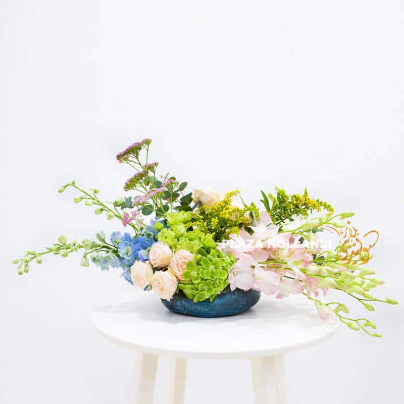 C L 02 European style flower arrangement with pink and blue flowers