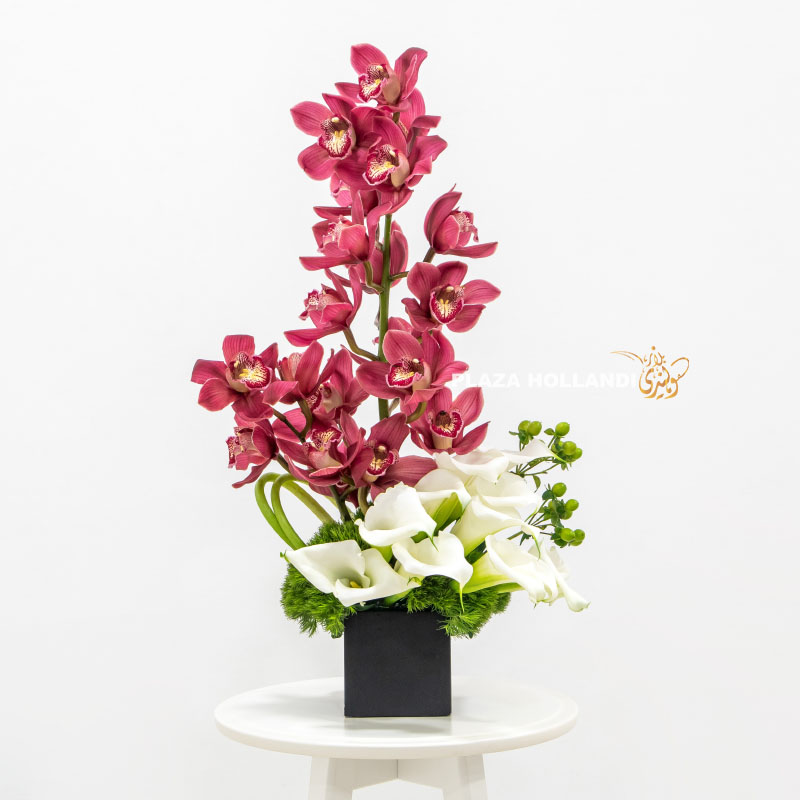 3 flowers in a wooden box