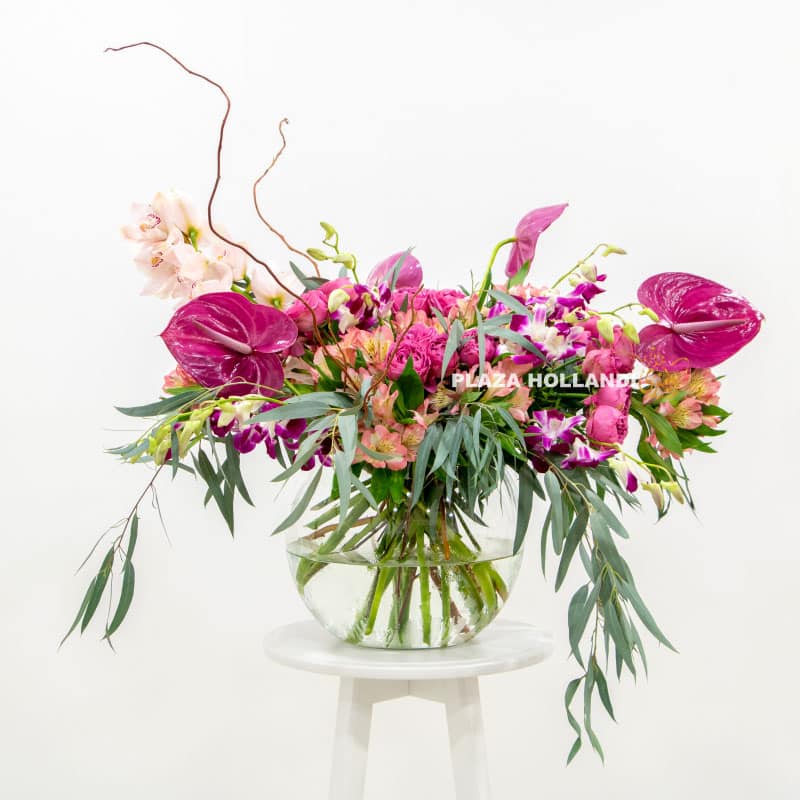 5 Loose purple flower arrangement in a vase