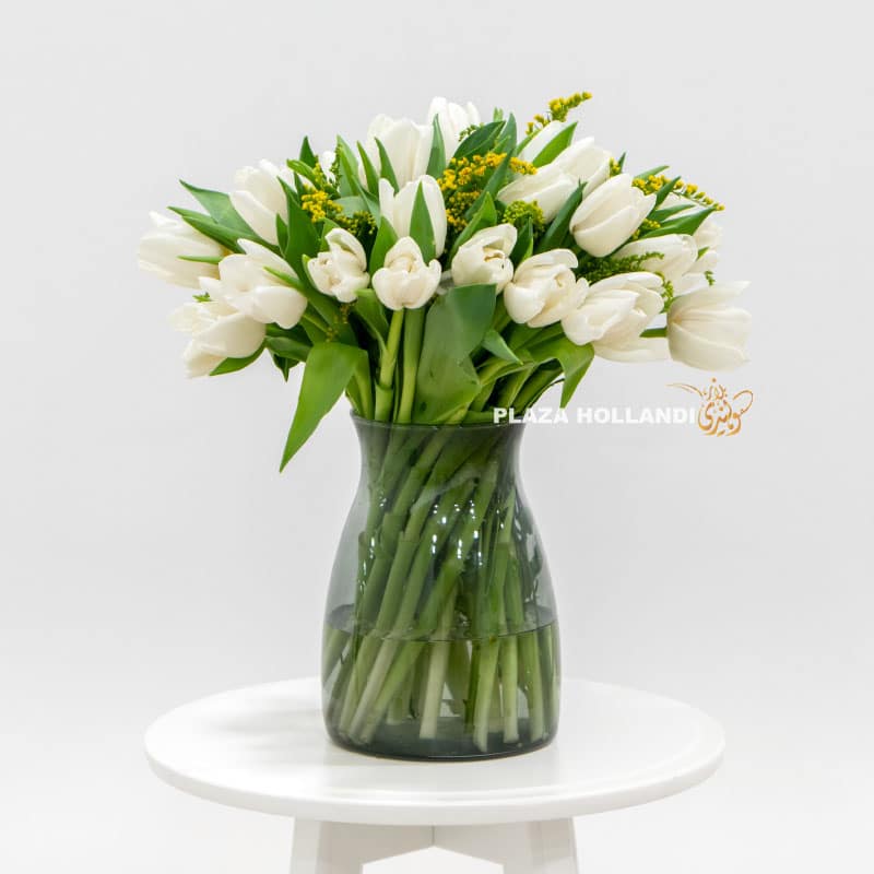 1 White Tulip bouquet in a glass vase