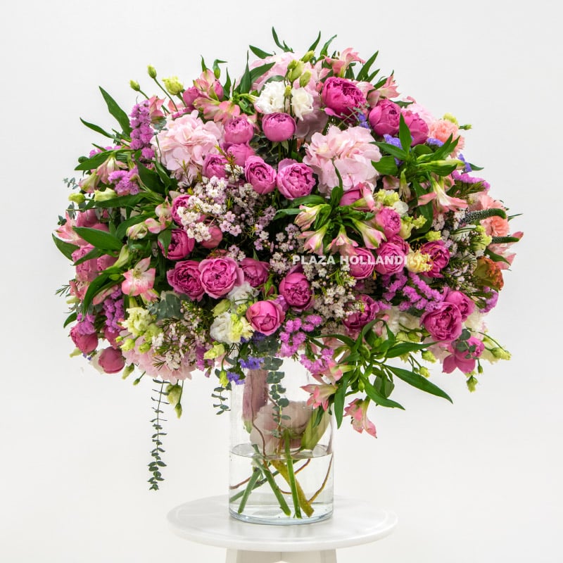 2 pink flower arrangement in a glass vase