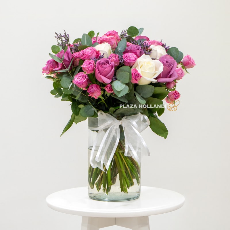 3 Bouquet of purple and white flowers in a vase