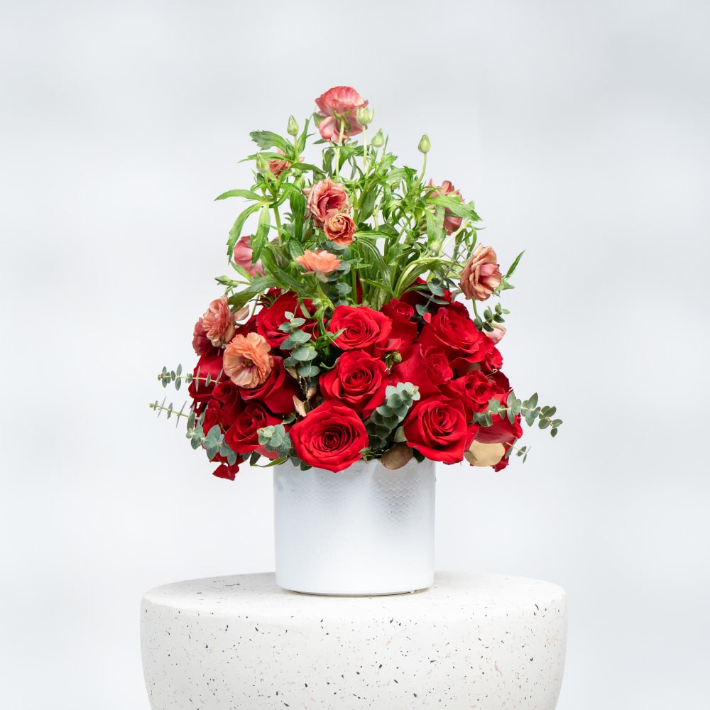 A21 White Pot Floral Display with Red Roses, Baby Roses & Eucalyptus