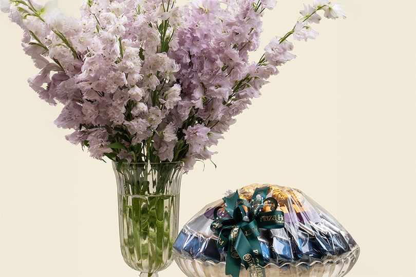 5.2 Purple Delphinium Arrangement with Chocolate in Glass Vase – 60cm