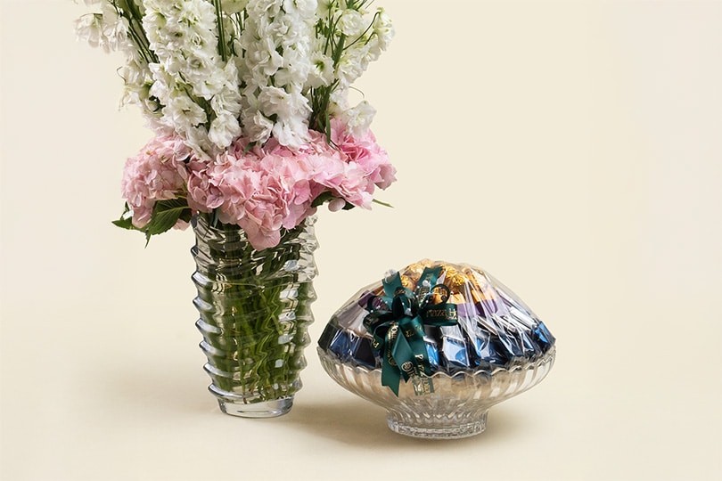 6.2 Delphinium & Hydrangea Arrangement with Chocolate in Glass Vase – 60cm